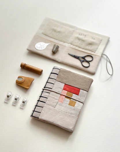 A patchwork needle case with three quilting clips, a leather thimble, a wooden needle cylinder case, and an open needle case showing a small black scissors, a metal thimble, and a threader